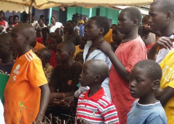 Away from court, Ongwen plays football and cleans the detention centre