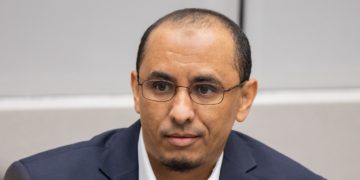 A former member of Ansar Eddine, Al Hassan Ag Abdoul Ag Mohamed Ag Mahmoud, listens to ICC judges during a February 19, 2020 court session. Al Hassan is on trial for crimes he is alleged to have committed in Timbuktu, Mali. Credit: ICC