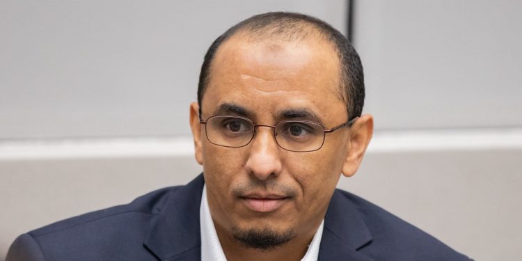 A former member of Ansar Eddine, Al Hassan Ag Abdoul Ag Mohamed Ag Mahmoud, listens to ICC judges during a February 19, 2020 court session. Al Hassan is on trial for crimes he is alleged to have committed in Timbuktu, Mali. Credit: ICC