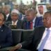 Somalia's President Mohamed Abdullahi Farmaajo and Kenya's President Uhuru Kenyatta listen to speeches during Farmaajo's inauguration ceremony in Somalia's capital Mogadishu [Feisal Omar/Reuters]