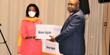 The Gambian Attorney General and Minister of Justice Dawda A. Jallow handing copies of the final report of the Truth, Reconciliation and Reparations Commission to the UN representative in Bijilo, The Gambia, on December 24, 2021.