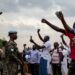 Central African army soldiers, Russian mercenaries, and UN peacekeepers at a meeting between President Touadéra and members of his MCU party, in Bangui, on 27 December, 2020. (Adrienne Surprenant/TNH)