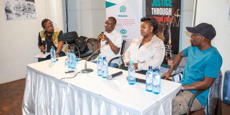 From left: Media and communications expert Kimani wa Wanjiru, journalist Tom Odhiambo, cartoonist Celestine Wamiru (Celeste), and syndicated political cartoonist Godfrey Mwampembwa (Gado) participate in a panel discussion during the launch of the second edition of the "Justice Through African Eyes" cartoon exhibition at the Kenya Cultural Centre’s Cheche Gallery on March 16, 2022. Photo credit: JFJ