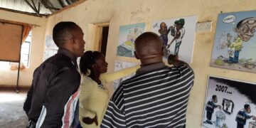 Nakuru residents at the “Justice Through African Eyes” cartoon exhibition at the Nakuru Social Hall on March 31, 2022. Photo credit: @Waceke Njoroge