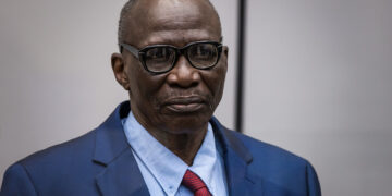 Ali Muhammad Ali Abd-Al-Rahman during the opening of his trial at the International Criminal Court in The Hague on Tuesday, April 5, 2022. He faces 31 counts of crimes against humanity and war crimes allegedly committed in Sudan's Darfur region two decades ago. Photo credit: @ICC-CPI