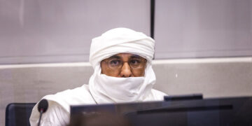 Al Hassan Ag Abdoul Aziz Ag Mohamed Ag Mahmoud listens to the proceeding during his opening statement before Trial Chamber X of the International Criminal Court (ICC) on May 9, 2022.