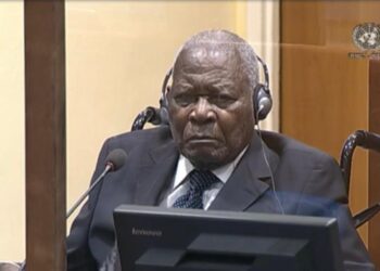 Rwandan genocide suspect Félicien Kabuga listens to proceeding during a status conference at the United Nations International Residual Mechanism for Criminal Tribunals courtroom in The Hague on August 18, 2022. His trial starts on September 29, 2022.