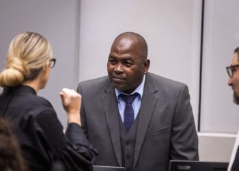 : Mahamat Said Abdel Kani consulting with his counsel Jennifer Naouri at the opening of his trial before the International Criminal Court (ICC) on September 26, 2022. Photo credit: @ICC-CPI