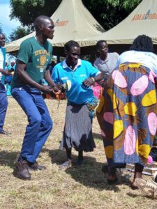 Albert Ocen Wokorach, a beneficiary of TPO-Uganda projects, and other victims dance to welcome the guests in Pader district,  northern Uganda. Photo credit: @Embassy of Ireland in The Netherlands, Twitter account 